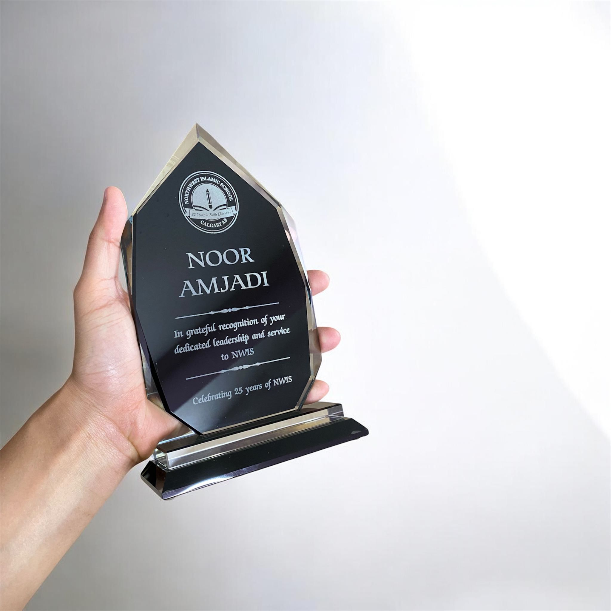 Custom glass award engraved with corporate logo
